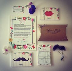 the wedding stationery is laid out neatly