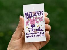 a person holding up a card that says trick drivers rock thanks for keeping our shoes follies