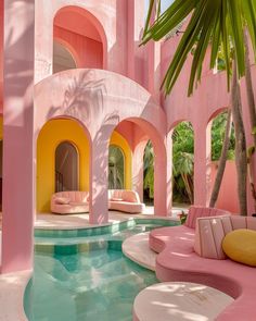 the interior of a pink and yellow house with an oval pool in front of it