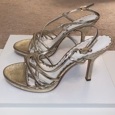 Nwt Nina Gold Heels Gorgeous Leather Strappy Sandals With 3 1/2” Heels And Small Platform In Front With Jeweled Closure Around Ankle Strap New And Never Worn Versatile Cocktail Shoes Perfect For A Night Out Or Wedding Guest Footwear Gold Metallic That Is Brushed And Neutral, Not In Your Face And Gaudy. In Some Lighting It Appears Almost Neutral Like A Silver. Elegant Metallic Sandals With Heel Strap, Metallic Heels For Summer Wedding, Elegant Closed Toe Metallic Sandals, Metallic Open Toe Heels For Wedding, Metallic Summer Heels For Cocktail, Summer Metallic Heels For Cocktail, Metallic Heels For Summer Cocktail Events, Elegant Metallic Sandals For Wedding, Silver Closed Toe Sandals With 4-inch Heel