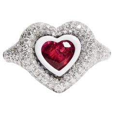 Heart cut Ruby accented with white enamel, outlining the heart shape with pave diamonds. Available in 4.500 grams of 18k White gold. Ruby, 1.45 CTS Diamond 1.40 CTS Ruby A true KAMYEN signature style, the heart pinky's have truly become synonymous with the brand. This ring should worn on the pinky or ring finger, as we don't recommend sizes above US 5. Pinky Rings For Women, Ruby Heart Ring, Kinetic Jewelry, Shiny Rings, Ruby Heart, Ring Ruby, Diamond Heart Ring, Heart Keyring, Heart Fashion