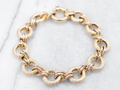 "This sophisticated bracelet offers a timeless style perfect for any occasion. Crafted with a luxurious yellow gold, it secures with a chunky spring ring clasp for a comfortable fit. Metal: 14K Yellow Gold Width: 12.9 mm Length: 7 3/4 Inches Marks: \"585 14KITALY\" Stamped on the clasp To view a video of this piece check out the link below: https://vimeo.com/831655879 SKU #: A27305 Each piece has been identified and graded by a Graduate Gemologist who has been certified by the Gemological Institute of America (GIA). We have six brick-and-mortar storefronts in Maine, Massachusetts, and New Hampshire and have been in business for over 25 years! Please visit our Shop's About Page or our website for more information about our jewelry. For questions about diamond grading, we recommend the Gemol Bracelet Layering, Rope Ring, Rope Rings, Spring Bracelet, Fine Silver Jewelry, Yellow Gold Bracelet, Layered Bracelets, Pearl Pendant, Chain Link Bracelet