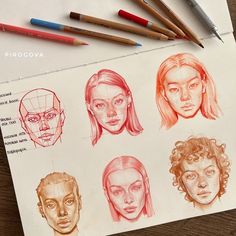 pencils are laying on top of a piece of paper with drawings of people's heads