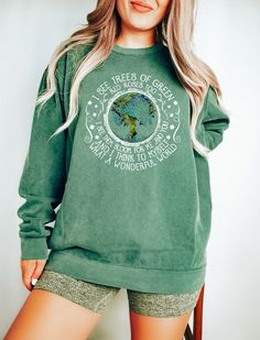 "I See Trees Of Green, Red Roses Too, Wonderful World, Tree Of Life, World Sweatshirt, Tree Sweatshirt, Comfort Colors®, Gift for Hippie Hi! WELCOME TO DELUXSTOREUSA This sweatshirt perfect gift as a holiday apparel. Ideal for any situation, a unisex heavy blend crewneck sweatshirt is pure comfort  Washing Care Instructors Use cold water when washing, do not use bleach, do not dry clean, and do not use an iron directly on the design.  Production Time Production time is 1-2 days. Delivery time varies depending on your delivery address. How to Order?   Please, choose your favorite color and size from the pop-up window.  Select the quantity that you want.  Click \"ADD TO CART\".  You can go back to add more product color for your loved ones members.  You can complete the checkout process.  Pl Butterfly Sweatshirt, Cottagecore Sweater, Cottagecore Shirt, Holiday Apparel, Comfort Colors Sweatshirt, Retro Sweatshirts, Plant A Tree, Tree Shirt, Comfort Colors Tee