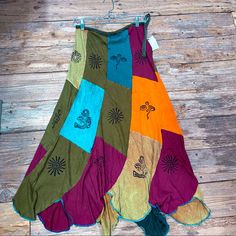 a multicolored skirt hanging on a wooden floor