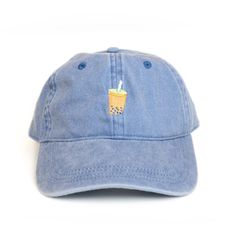 a denim cap with a drink embroidered on the front and side, sitting against a white background