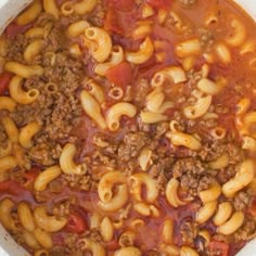 a pot filled with pasta and meat sauce