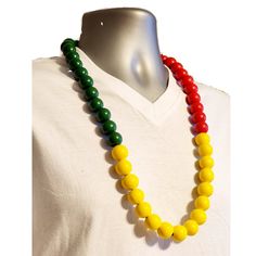 🌟 Celebrate Rasta Culture with a Bold Rastafarian Statement! 📿 Introducing a vibrant and culturally rich masterpiece that's more than just a necklace; it's a bold symbol of Rastafarian culture and pride. Handcrafted in limited quantities, this necklace is a truly exceptional addition to your collection.  Striking Rasta Colors  Meticulously designed, this necklace boasts thick wooden beads in three striking colors - Green, Yellow, and Red - representing the iconic Rasta colors, symbolizing unit Multicolor Festival Necklaces, Multicolor Round Necklace For Festivals, Multicolor Round Necklaces For Festivals, Yellow Necklaces With Colorful Beads For Festivals, Spiritual Green Necklaces For Festivals, Traditional Multicolor 8mm Bead Jewelry, Traditional Multicolor 8mm Beads Jewelry, Traditional Multicolor 8mm Beaded Jewelry, Traditional Multicolor Jewelry With 8mm Beads