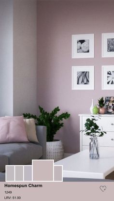 a living room filled with furniture and pictures on the wall next to a coffee table