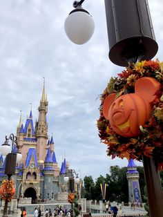 the castle is decorated with pumpkins and leaves