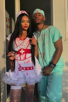 a man standing next to a woman dressed as a nurse in front of a door