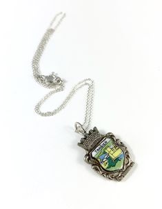 "This necklace is made from the end of a vintage souvenir teaspoon from Tangier. It has a beautifully detailed image of a church. I have cut, filed and sanded the charm down to a perfect finish and the whole charm sits on a sterling silver chain. I have soldered a sterling silver ring on the top for the chain to slide through. If you would like to purchase just the charm, please choose \"0 Inches\" from the drop down menu. Measurements: Charm Height: 32 mm / 1.25\" Charm Width: 20 mm / 0.78\" Ch Silver Medallion Necklace Souvenir, Silver Medallion Necklace For Souvenirs, Silver Medallion Necklace As Souvenir, Personalized Silver Necklace For Souvenir, Spoon Necklace, Spoon Jewelry, Tangier, Vintage Souvenir, Wife Gift