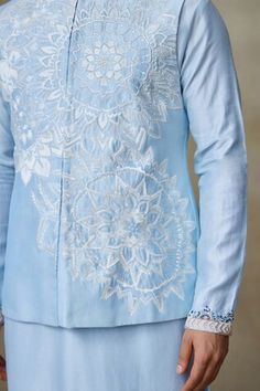 Icy blue Nehru jacket with resham, zari thread embellishment in geometric cutwork pattern. - Aza Fashions Blue Nehru Jacket With Intricate Embroidery For Diwali, Diwali Blue Nehru Jacket With Intricate Embroidery, Designer Blue Nehru Jacket With Zari Work, Designer Blue Nehru Jacket For Diwali, Designer Blue Nehru Jacket With Intricate Embroidery, Blue Cotton Nehru Jacket With Zari Work, Blue Nehru Jacket With Chikankari Embroidery For Festive Occasions, Festive Blue Nehru Jacket With Chikankari Embroidery, Blue Nehru Jacket With Intricate Embroidery For Festive Occasions