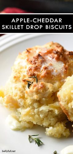 an apple - cheddar skillet drop biscuits on a white plate