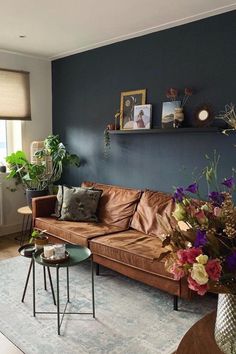 a living room filled with furniture and flowers