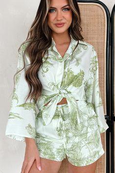 100% POLYESTER Model Wearing Size Small Color: Light Green Tropical Print Comes As A Set: Top & Shorts Top: Collared Shirt, Button-Front, Wide Sleeves, Loose/Slightly Oversized Fit Shorts: Elastic Waistband, Drawstring Tie, Front Pockets, Lined Top Does Not Have Stretch / Shorts Have Stretch In The Waistline Top: 16" Armpit To Sleeve End, 20" Armpit To Hemline Shorts: 13" High Rise, 2.5" Inseam Video Product Color May Not Be Accurate For Model Size Specs Please Check Size Charts Launched: 2/1/24 Spring Button-up Sets For Day Out, Printed Long Sleeve Summer Sets, Green Button-up Sets For Summer, Green Collared Sets For Spring, Green Collared Spring Sets, Summer Long Sleeve Sets For Brunch, Long Sleeve Floral Print Sets For Beach, Spring Long Sleeve Sets For Day Out, Chic Summer Sets With Button Closure