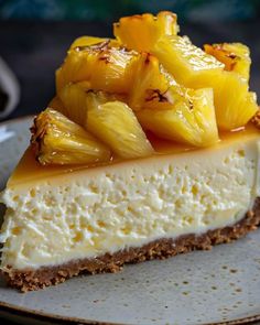 a piece of cheesecake with pineapple topping on a plate