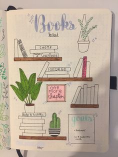 a notebook with books and plants on it