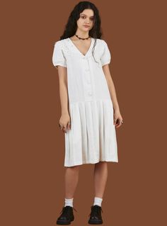 The Konoha Dress is a mid-length, drop-waist dress with a tonal button front, lace detailing at the collar along with hand-embroidered flowers. Fit is true to size.  100% Cotton Imported UWD-1612 White Long Skirt, Hand Embroidered Flowers, White Cotton Dress, Cotton Midi Dress, Dropwaist Dress, Lace Collar, Drop Waist, White Skirts, This Moment