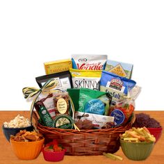 a basket filled with lots of food on top of a wooden table