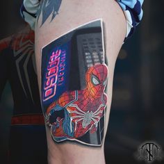 a spider - man tattoo on the right thigh