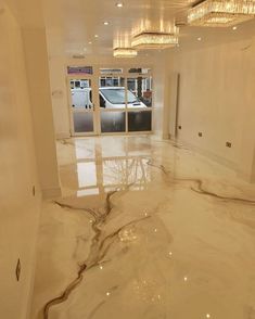 an empty room with marble floors and chandeliers