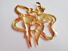 "Striking gold tone large JJ Jonette Art Deco elegantly dressed couple out for a night out on the town. This statement brooch measures 2 3/4\"H X 2 1/2\"W. Signed JJ. Mint condition." Elegant Couple, Mint Condition, Brooch Pin, Night Out, Mint, Gold Tones, Art Deco, Gold, Art