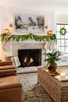 a living room filled with furniture and a fire place in front of a painting on the wall