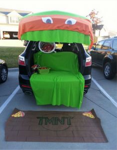 the trunk of an suv is decorated to look like a car with food in it