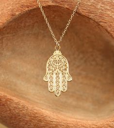 Hamsa necklace - gold hamsa charm - hand of god - amulet necklace - 14k gold filled chain This beautiful 14k gold vermeil hamsa hangs from an 18 inch 14k gold filled chain. Please feel free to select a different length chain if you prefer :) This beauty is also available in sterling silver :) The Hand (Khamsa), particularly the open right hand, is a sign of protection that also represents blessings, power, and strength, and is seen as potent in deflecting the evil eye. Charm measurements: 25mmx1 Spiritual 14k Gold Filled Yellow Gold Charm Necklaces, Spiritual 14k Gold-filled Yellow Gold Charm Necklace, Spiritual 14k Gold Filled Charm Necklace, Bohemian 14k Gold Filled Charm Necklaces For Gifts, Spiritual 14k Gold-filled Charm Necklace, Spiritual 14k Gold-filled Charm Necklace With Adjustable Chain, 14k Gold-filled Spiritual Charm Necklace With Adjustable Chain, Spiritual 14k Gold Filled Pendant Necklace, Spiritual 14k Gold-filled Necklaces