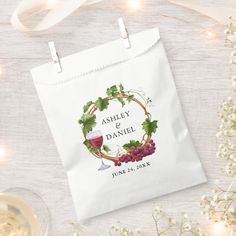 a wine bag with the words ashley and danielle on it next to some flowers