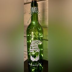 a green bottle with some lights on it