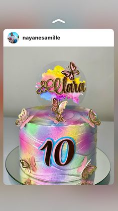 a birthday cake decorated with butterflies and the number ten