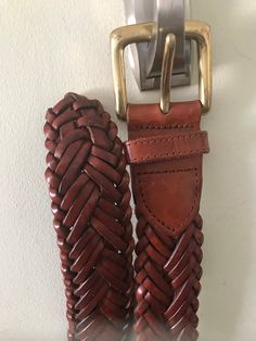 "Braided brown leather belt, heavy brass buckle in very good vintage condition. Sizes for a 32\" waist, either a male or female can wear this belt. Measurements are; 38 1/4\" x 1 1/2\" ( measurements taken from the tip of the belt to the base of the brass buckle) Buckle 2\" x 2\" Feel free to convo me with any further questions. Thank you for your interest." Formal Brown Belt With Antique Buckle, Vintage Brown Belt Buckles With Matching Belt, Formal Brown Belts With Antique Buckle, Brown Belt With Antique Buckle Classic Style, Formal Brown Belts And Suspenders With Brass Buckle, Formal Brown Belt With Brass Buckle, Brown Formal Belt With Antique Buckle, Classic Brown Belt With Antique Buckle, Brown Classic Belt With Antique Buckle