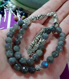 ✔️ 8 mm faceted Beads. ✔️ AAA grade Natural Labradorite Stone ✔️ Natural Color ✔️ This glamorous tasbih is a very special gift for your loved ones. ✔️ Each order comes in a special box. ✔️ PLEASE CLICK THE LINK FOR ALL PRAYER BEADS MODELS https://www.etsy.com/shop/GoodJewelsofYazmasal Note: As a natural feature the stones beads may have some variations. SHIPPING: United States (Standart/DHL eCommerce/usps): 7-10 business days United States (Express/FedEx): 3-5 business days Canada (Express/FedEx Faceted Spiritual Beads For Gifts, Adjustable Rosary With Faceted Round Beads, Gemstone Beads Rosary As Gift, Spiritual Silver Faceted Beads, Handmade Rosary With Round Beads As Gift, Silver Rosary With Faceted Round Beads, Silver Rosary With Faceted Beads, Handmade Silver Round Beads, Silver Beads Gems And Cabochons For Gifts