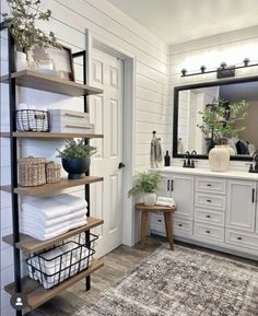 the bathroom is clean and ready to be used as a storage area for linens