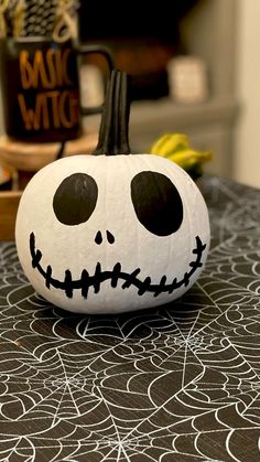 a pumpkin decorated with black and white designs