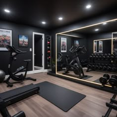 a home gym with exercise equipment and mirrors