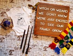 a wooden sign that says witch or wizard, we don't know were just excited to see our family grow