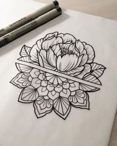 a drawing of a flower on paper with markers