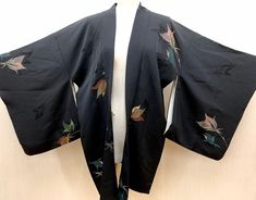 This is a Japanese  Silk Kimono Haori Jacket. Not included the Obi Belt. Length approx 80 cm  Width approx 130 cm  Material : Silk Condition : Vintage Excellent / Please check photo. **CARE : dry clean recommended Please don't hesitate to contact me if you have any question! Please see other items. https://www.etsy.com/jp/shop/YUMEYAKKOJapan?ref=hdr_shop_menu Traditional Black Kimono For Fall, Black Kimono For Fall, Traditional Black Fall Kimono, Black Embroidered Fall Kimono, Vintage Black Outerwear With Kimono Sleeves, Black Haori, Long Kimono Dress, Short Kimono Robe, Haori Jacket