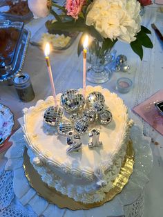 a birthday cake with two candles on it