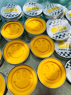 many tins with smiley faces on them