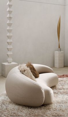 a white chair sitting on top of a shaggy rug