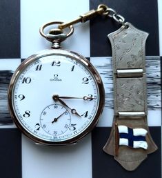 OMEGA Swiss watch made of silver 800 pr. Mechanical watch is in good working condition. Comes with original box and silver keychain with the flag of Finland. This watch was made in 1952. Watch case is in good condition (has signs of time) - see on photos. Dial has damage at 10 o'clock Rare antique Swiss mechanical pocket watch.  There is an inscription OMEGA and serial number: 13502977. You can check the SN here -  https://serial-number-decoder.co.uk/omega/omega.htm Watch case and two rear cover Antique Silver Watch Accessories For Gift, Antique Silver Watch Accessories As Gift, Antique Silver Watch Accessories Gift, Antique White Gold Watch As A Gift, Antique White Gold Watch As Gift, Antique Polished Watch Accessories, Antique Polished Finish Watch Accessories For Gift, Antique White Gold Collectible Watch, Antique Silver Pocket Watch With Subdials