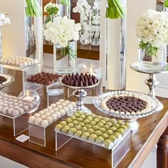 a table topped with lots of different types of candies and desserts on top of it