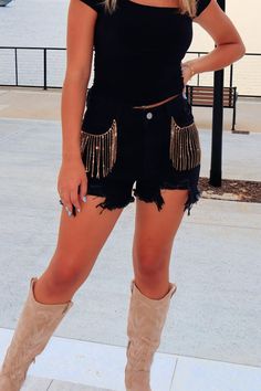 Step up your summer style with our Tabitha Rhinestone Denim Shorts! Featuring distressed thigh details and frayed bottom with a touch of sparkle from the rhinestone pocket front. Perfect for a country music concert or a night out with girlfriends, these shorts can easily be dressed up or down. Get ready to turn heads in these fun and flirty shorts! True to size. 85% cotton, 15% Polyester Model is 5'7 wearing small Country Music Concert, Rhinestone Denim, Country Music Concerts, Activewear Sets, Music Concert, Dress Romper, Country Music, Step Up, Summer Style