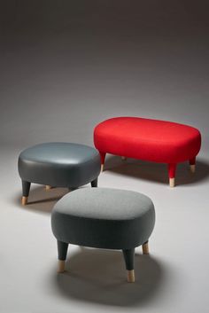 three different colored foot stools sitting next to each other