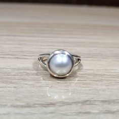 White Moti Ring Design In Silver, Fine Jewelry Sterling Silver Pearl Ring With Oval Shape, Oval Sterling Silver Pearl Ring, Fine Jewelry Oval Pearl Ring In Sterling Silver, Oval Sterling Silver Pearl Ring In Fine Jewelry Style, Silver Pearl Ring With Polished Finish For Wedding, White Sterling Silver Pearl Ring With Polished Finish, White Pearl Ring With Polished Sterling Silver, White Pearl Ring With Polished Finish