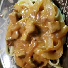 a plate with noodles and sauce on it